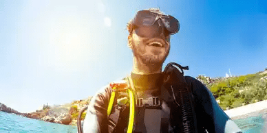 A man in scuba gear with goggles on.