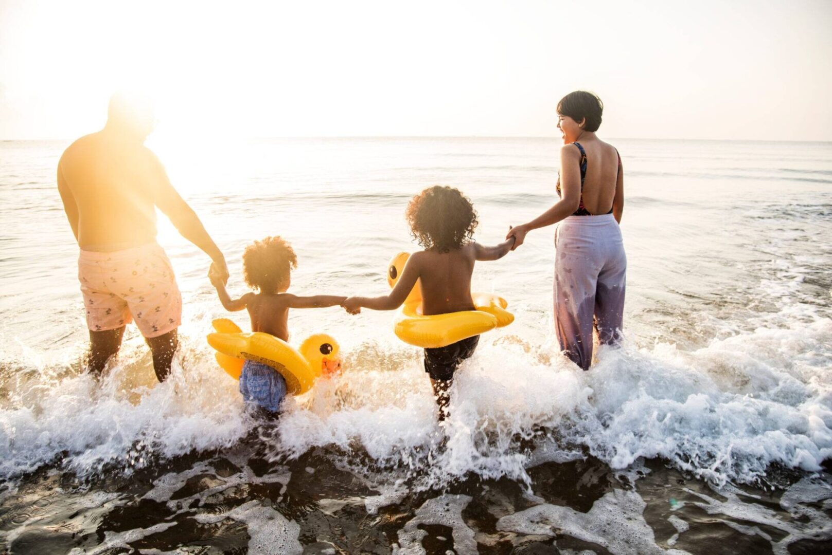 A family playing in the water at the beach