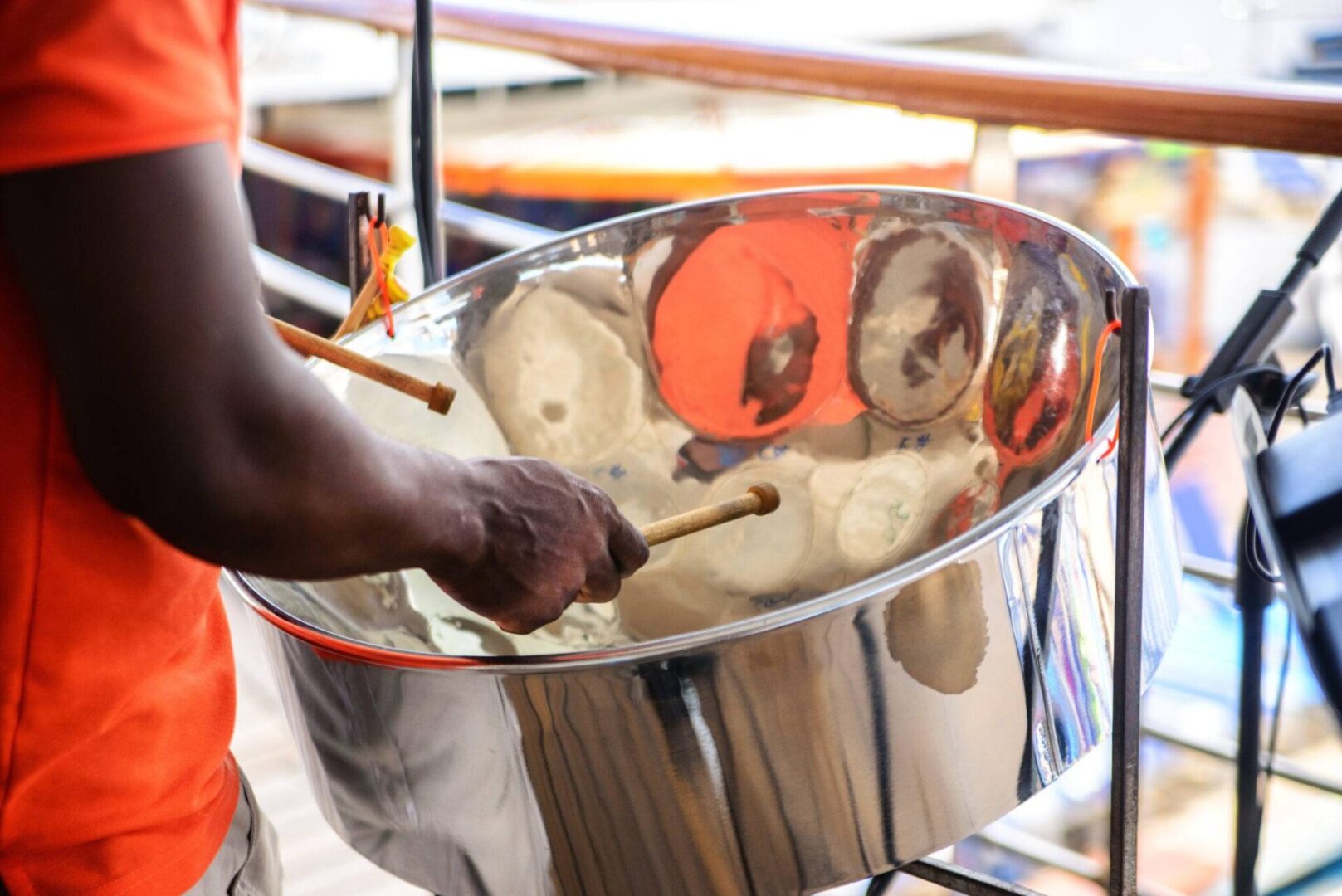 A person is playing the steel drum